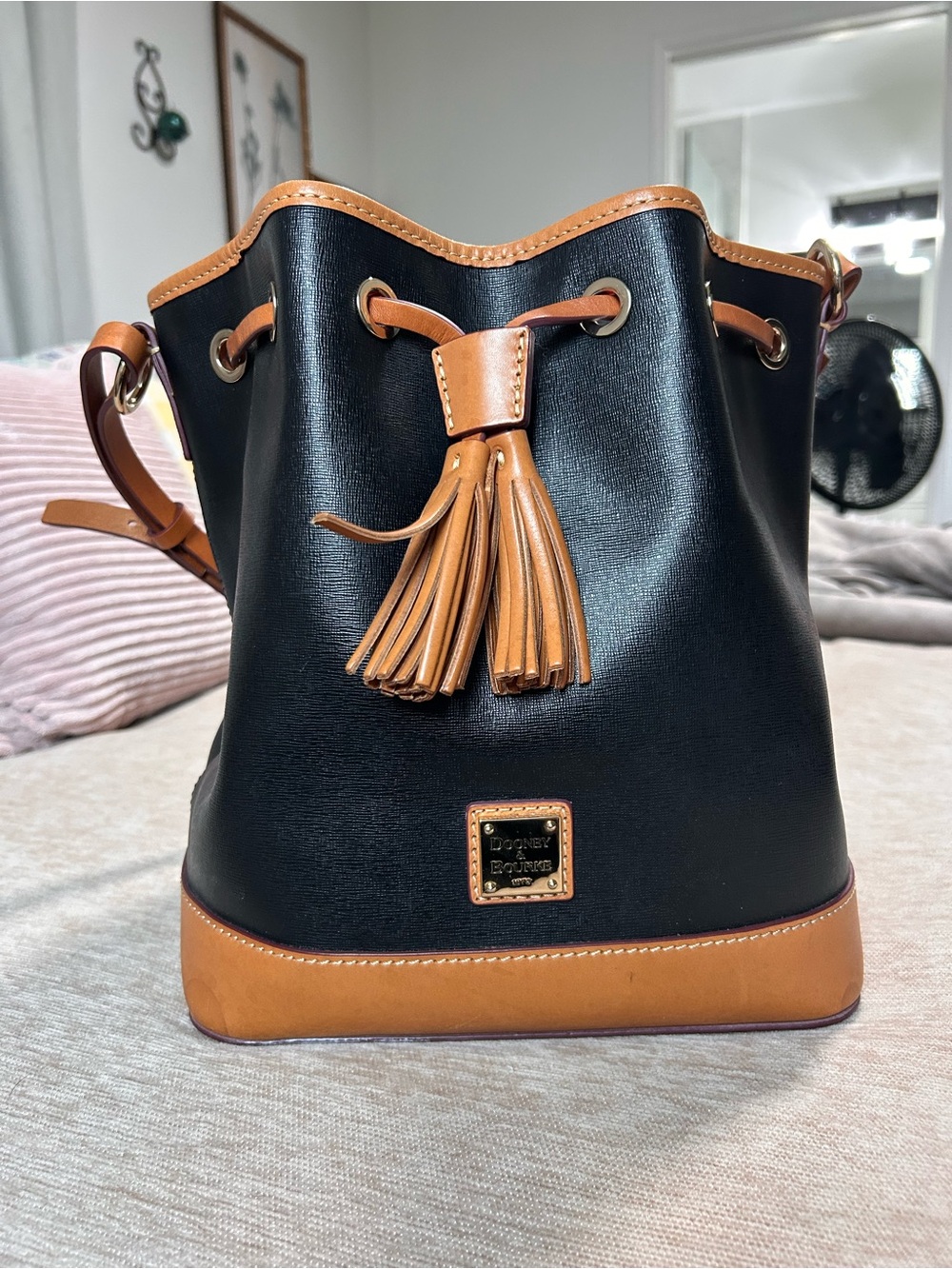 Dooney & Bourke Black and Tan Leather Tassel Bucket Bag